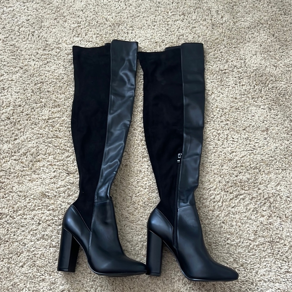 Over the knee black boots. Worn for minutes lol